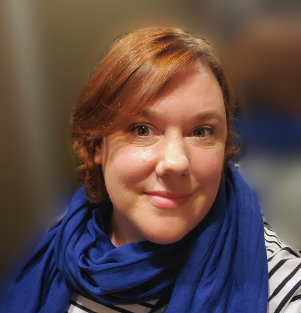 Photo of Cam Lamblin wearing a blue scarf