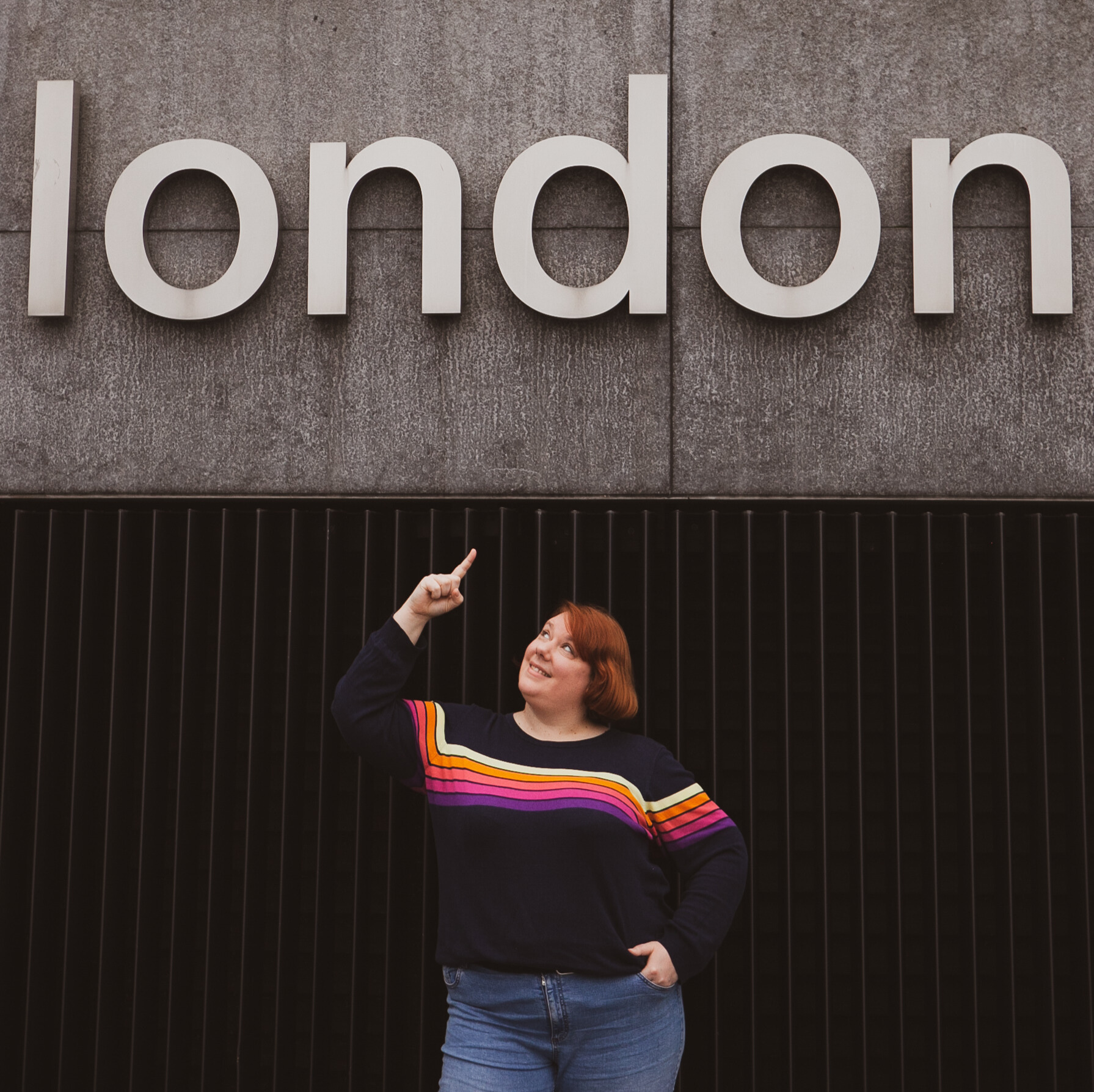 Cam Lamblin pointing at a London sign